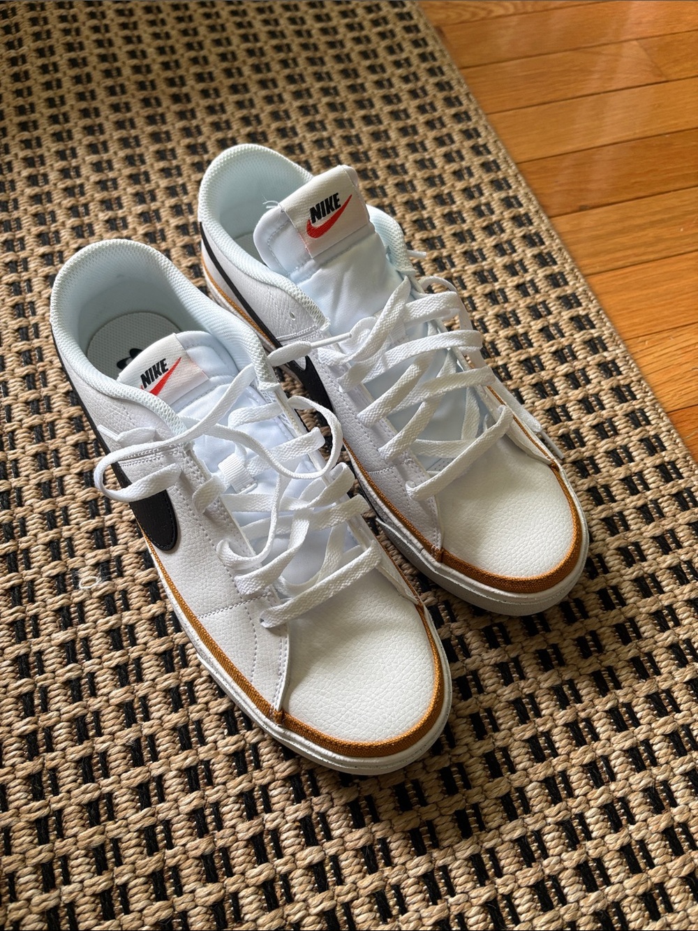Nike Men’s White Sneakers with Black Swoosh and Brown Accent